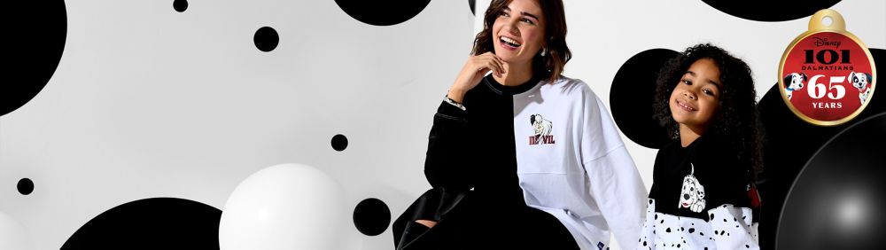 Cartoon dalmation puppies from 101 Dalmations joyfully running on a red background.