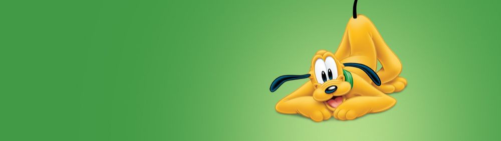Pluto, the playful pup, lies down with a mischievous grin. His perked-up ears and raised butt add to his adorable charm. Green background.