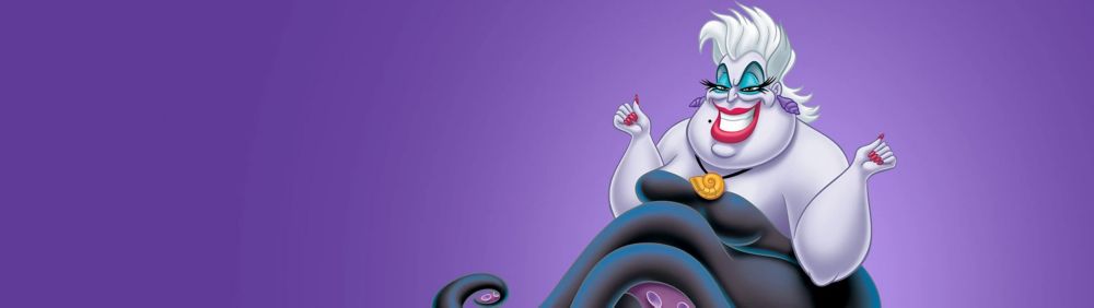 Ursula confidently strikes a sassy pose, wearing a mischievous smirk. Her hands are raised with clenched fists against a purple backdrop.
