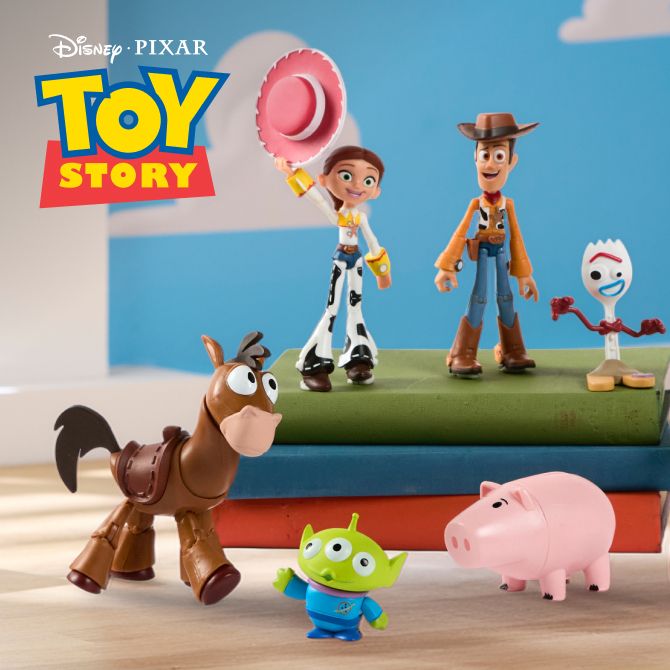 Toy Story figures, including Woody, Jessie, Forky, and Bullseye, are arranged on books with the Toy Story logo. Cloud backdrop.