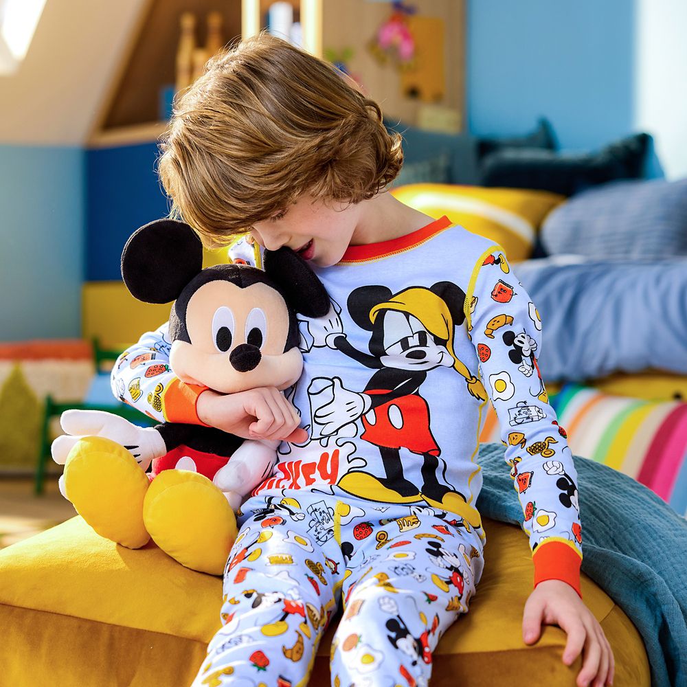 boy in a onesie pj of sulley from monsters inc