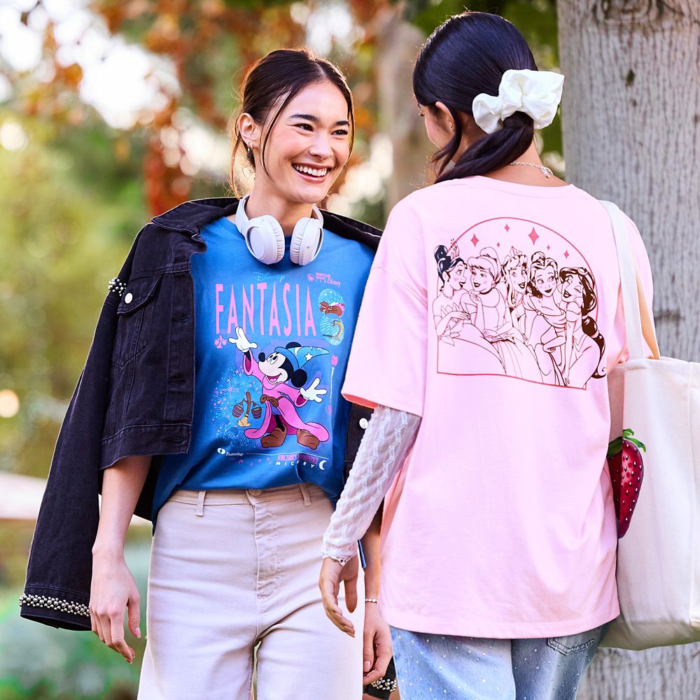 Three Disney shirts against a teal background; an Eeyore shirt, a Disney Princess shirt, and a Tinker Bell shirt.