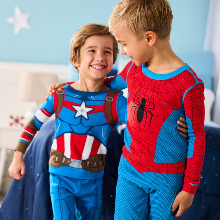 boy in a onesie pj of sulley from monsters inc