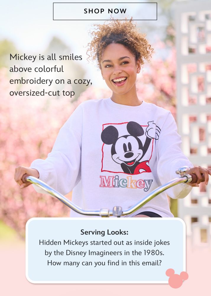 Shop Now | Mickey is all smiles above colorful embroidery on a cozy, oversized-cut top | Serving Looks: Hidden Mickeys started out as inside jokes by the Disney Imagineers in the 1980s. How many can you find in this email?